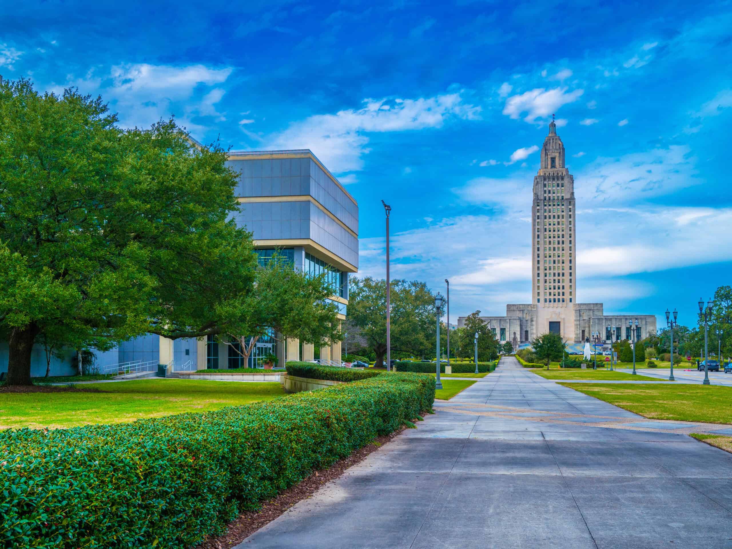 Modern cityscape with the historic LeVeque Tower in Columbus, Ohio, showcasing urban architecture and lush greenery, emphasizing professional plumbing services and reliable emergency repairs by Jake's Pros.